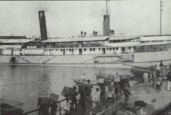 TEA FOR FOREIGN LANDS  Foreign steamers being loaded with native cargoes for export; scene on the Hankow Bund. The tea trade of China has lost considerable ground in recent years.