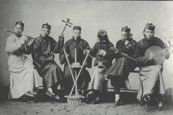 QUAINT CHINESE ORCHESTRA HALWAYS MEN  Typical old-time orchestra anywhere in China; the Chinese say, "Once a musician, always a musician"—so it usually runs in the family.