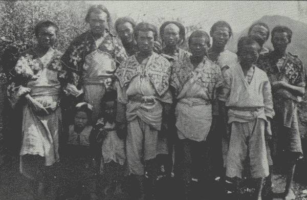 MOTLEY GROUP OF HUA MIAO MENFOLK  Picture gives an idea of how the Hua Miao in certain sections are being gradually absorbed by the Chinese; these men are typical tenant farmers of the Nou-su.