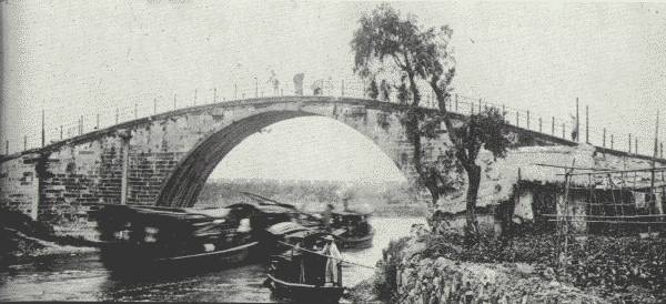 TYPICAL SINGLE-SPAN BRIDGE OF INLAND CHINA.  Engineers say that China possesses bridges of more varied design than any other country.