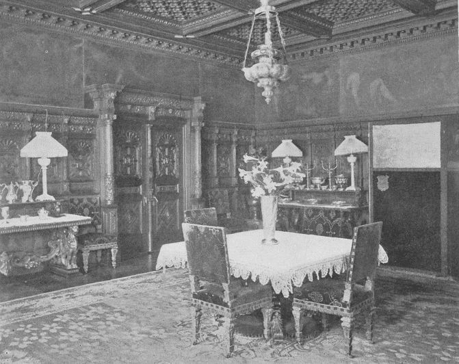 DINING-ROOM IN NEW YORK HOME SHOWING CARVED WAINSCOTTING AND PAINTED FRIEZE