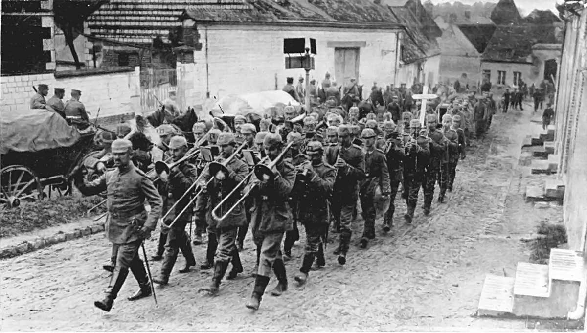 AS USED IN THE GERMAN TRENCHES: A GERMAN BAND PLAYING ON THE MARCH DURING THE WAR.