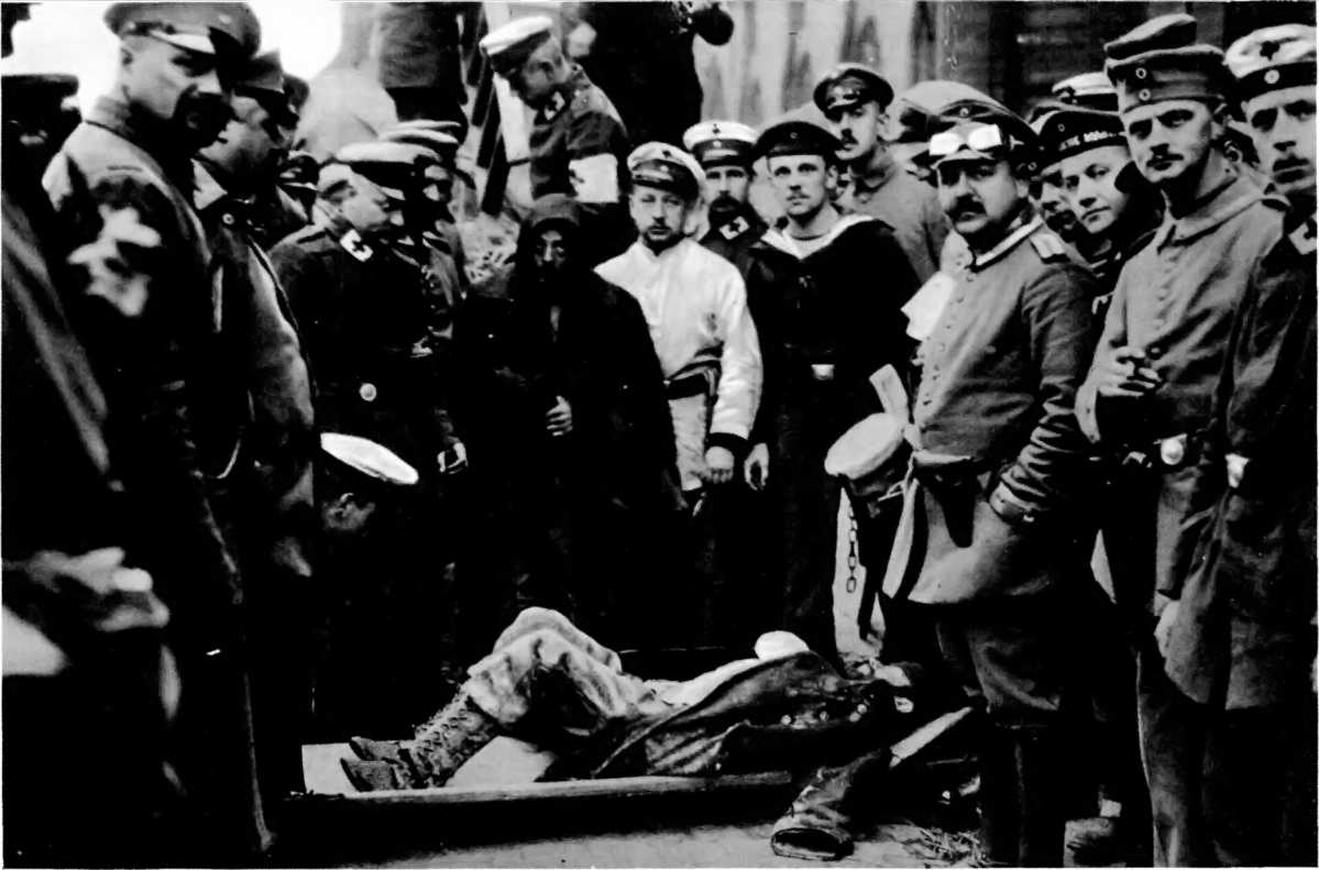 "MISSING AND WOUNDED," AT BRUGES: STRICKEN BELGIANS IN CHARGE OF GERMAN RED CROSS MEN.