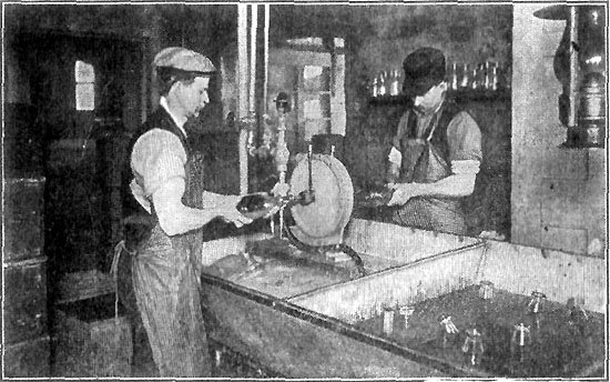 WASHING THE BOTTLES AT A MODEL DAIRY