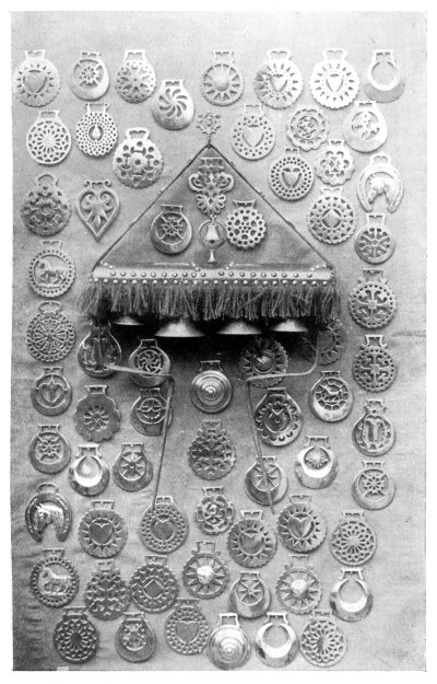 FIG. 84.—COLLECTION OF HARNESS AMULETS AND TEAM BELLS.  (In the possession of Mr. Charles Wayte, of Edenbridge.)