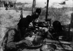 CONGO NATIVES PICKING OUT DIAMONDS