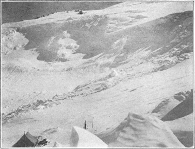 Third camp in the Grand Basin—17,000 feet, showing the shattering of the glacier walls by the earthquake.