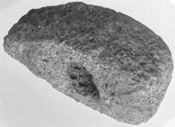 Hammer Head, found near the Wong, length 6⅝-in., width 3⅞-in. weight 3½-lb.; of porphyry from the Cheviot region, Neolithic period.  The stone was probably part of a large boulder