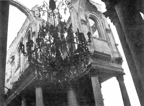 The stone roof over this glass chandelier in the Arras cathedral was destroyed by shells, and the chandelier not touched.