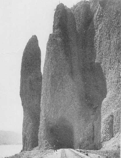 Along the Columbia—"Grotesque rocks rise sheer from the river's edge"  