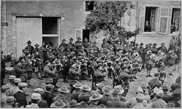 Copyright by the Committee on Public Information.  Buglers of the Alpine Chasseurs, assisted by their military band, entertaining American soldiers of the First Division.