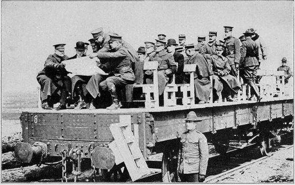 Copyright by the Committee on Public Information.  Secretary Baker riding on flat car during his tour of inspection of the American Expeditionary Forces.