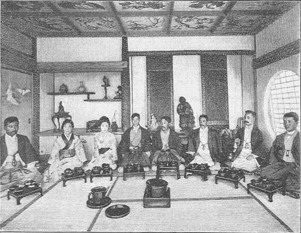 Chinese people seated for a meal