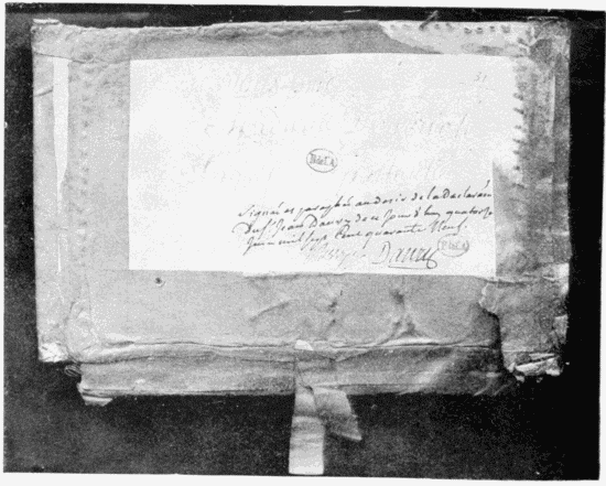 Cover of the explosive box sent by Danry to the Marquise de Pompadour. The words almost obliterated are: “Je vous prie, Madame, d’ouvrir le paquet en particulié.” Below is the record and the date of Danry’s examination, with his signature, and that of Berryer, the lieutenant of police. 