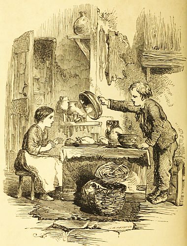 Boy lifting cover off of roast chicken while girl at table watches