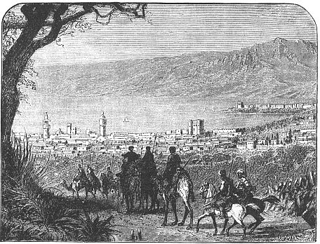 caravan with large city in distance