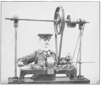 BANGERTER’S AUTOMATIC JEWELER.  This Automatic Jeweler Making Collar Buttons at the Belgian World Exposition, 1905, Often Mistaken for a Living Man. Thousands of Collar Buttons of His Make Were Sold Within the Exposition Grounds.