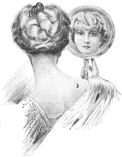 head and shoulders of Lady with back to us, but seeing face in hand mirror