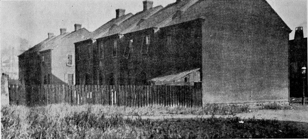 Wooden Shacks Used as Living and Sleeping Quarters in a Railroad Camp.