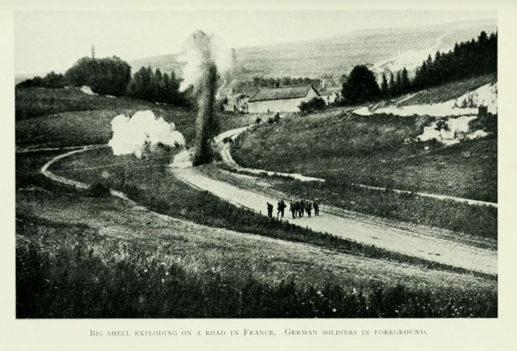 Big shell exploding on a road in France. German soldiers in foreground.