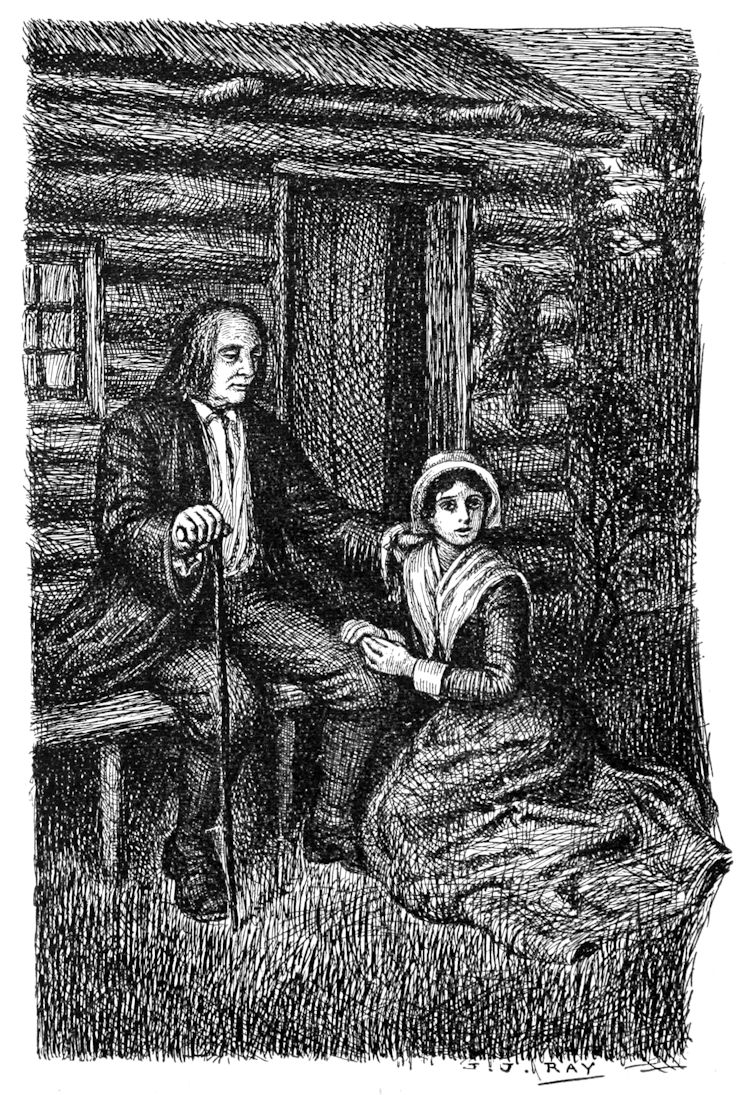 A man and a woman outside by a cabin door