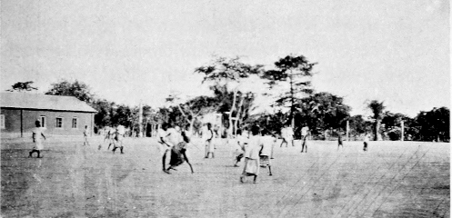 1. SCHOOLBOYS PLAYING HOCKEY.