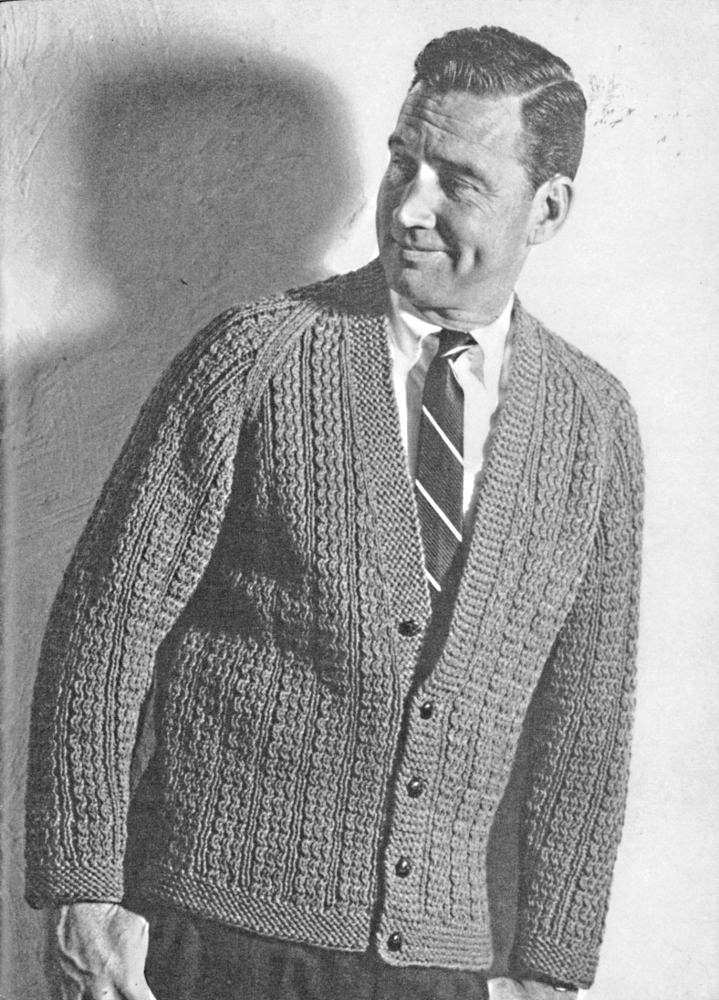 Man standing wearing knit sweater