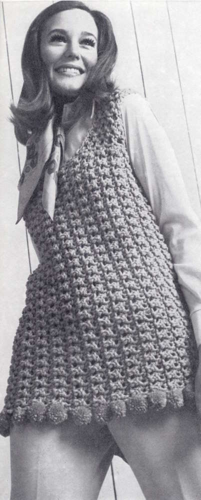 Lady standing wearing a crocheted shell
