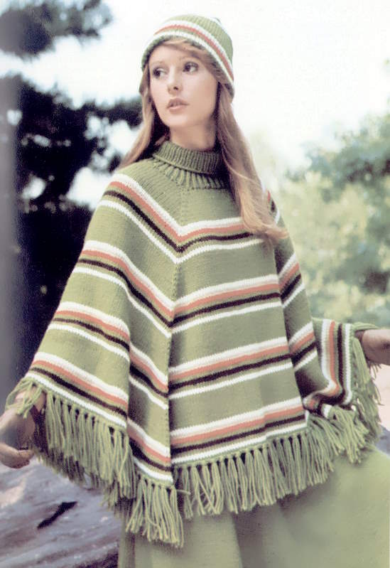 Woman wearing poncho and hat