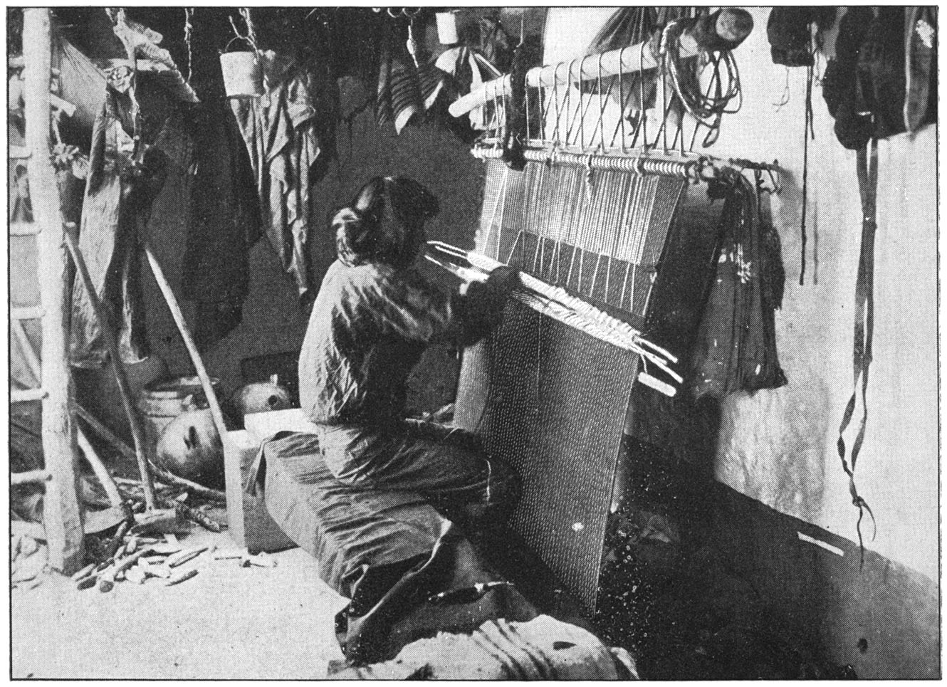 Moki weaving. Clay Dishes and Tools in Background