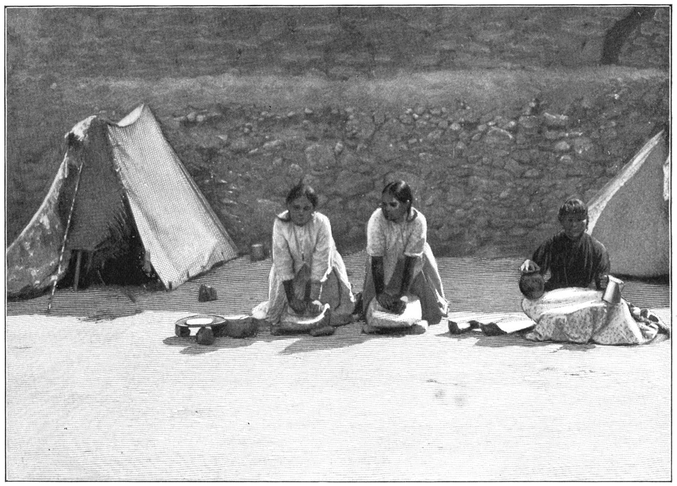 Pueblo Women grinding Corn