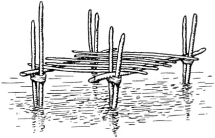 Holzgestell, auf dem ein    Fischer sitzt