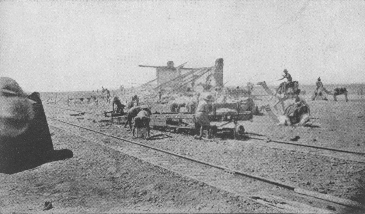 Photo wide shot of men working a railway