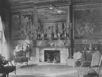 The rare console tables and chairs and the Gobelin
tapestry, "Games of Children," show to great advantage in this
beautifully proportioned room of soft dull gold. The side-and
centre-lights, reflected in the mirror, light the room correctly