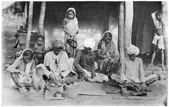 Chamārs cutting leather and making shoes.