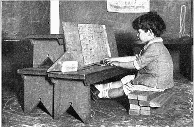 Boy playing pretend piano.