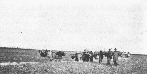 Eld. Steigerwald and Mr. Doner with Carriers
on Their Trip North of Macha.