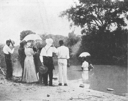 First Baptismal Scene at Macha. Native
Congregation Not Visible.
