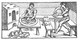 Fig. 25.—Venetian Potters of the Sixteenth Century.
Showing two kinds of potter’s wheels in use among them. (From engraving
by V. Biringuccio.)