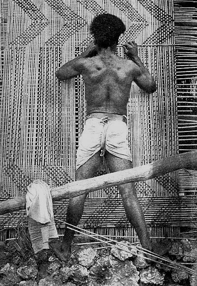 Weaving the walls of a Fijian house