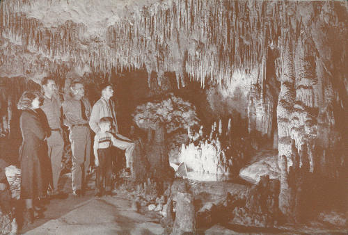 As visitors explore the well-lighted trails and passageways, they notice the icicle-like formations that hang from the ceilings and the heavier ones that project from the floor. They study the columns that seem to help support the rock above and the small passages that extend in many directions. They notice sea shells imbedded in walls and ceilings.